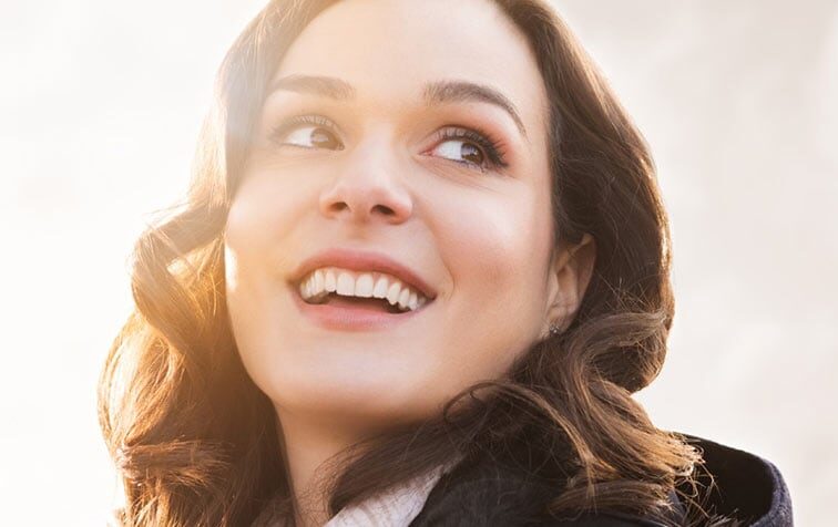 Glowing Smile from a Beautiful Woman | Cosmetic Dentistry Solutions in West Liberty, IA, North Liberty, IA and Muscatine, IA | Gentle Family Dentists