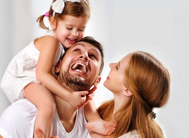 Happy Family of Three | Family Dentistry in West Liberty, IA, North Liberty, IA and Muscatine, IA | Gentle Family Dentists