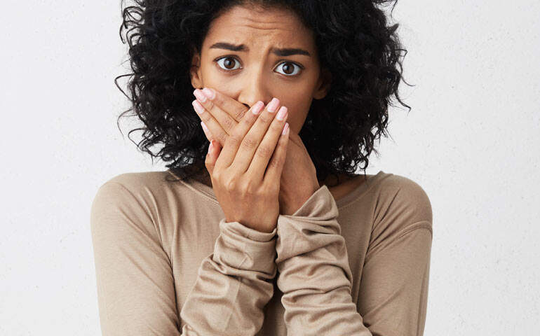 Lady Covering Her Mouth | Cosmetic Dentistry Solutions - Improve Your Smile in West Liberty, IA, North Liberty, IA and Muscatine, IA | Gentle Family Dentists