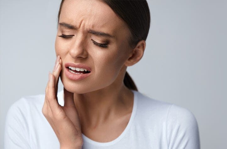 Lady pained with her toothache | Restorative Dental Treatments: Chewing Difficulty Solution in West Liberty, IA, North Liberty, IA and Muscatine, IA | Gentle Family Dentists