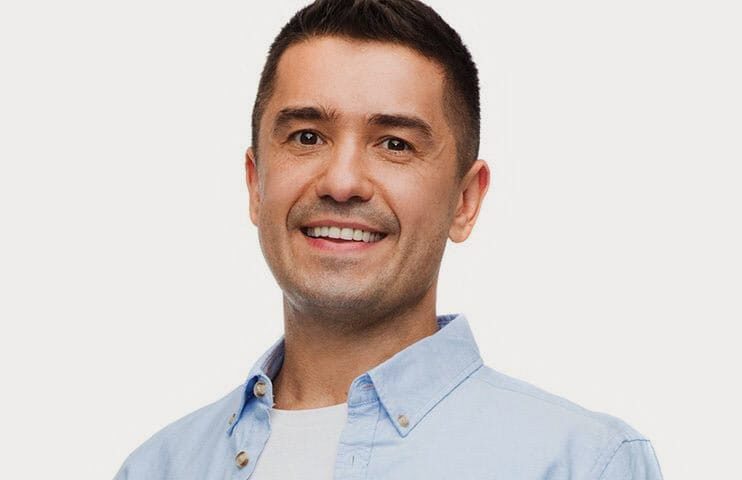 Good-looking Guy smiling shyly | Dental Crowns, Dental Bridges in Muscatine, IA | Gentle Family Dentists