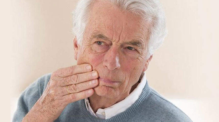 Old Man suffering a dental pain | Dental Emergency Care in West Liberty, IA | Gentle Family Dentists