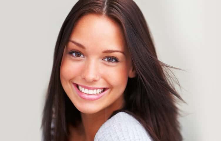 Lady showing a glowing smile | Teeth Whitening Solution in Muscatine, IA | Gentle Family Dentists